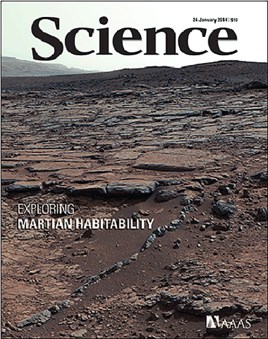 Figure 4. Science cover. Eroded landscape of Yellowknife Bay, Gale crater on Mars. Sheepbed mudstone is seen in the foreground, ~ 4 meters distant from the Curiosity rover camera that took the photo; Gillespie sandstone is in the middle field. The foothills of Mt. Sharp (upper left), ~ 20 kilometers distant, are Curiosity's ultimate destination. Exploration of this region by the Curiosity rover offers evidence of an ancient, potentially habitable environment. Image: NASA/JPL-Caltech/Malin Space Science Systems