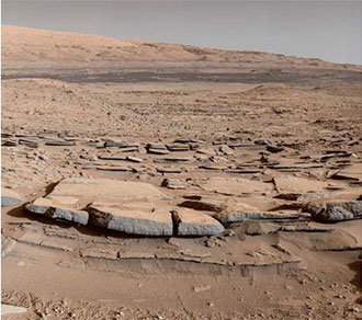 Photo.    Southward -dipping    sandstone    rock    facies    typical    of    the    foreset    beds    observed    over    9    kilometers    in    Gale    crater.    