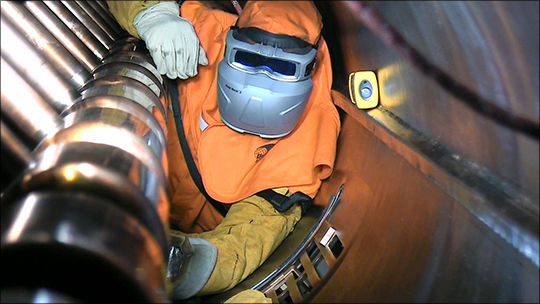Jason Burkhart in the LANSCE accelerator drift tube.