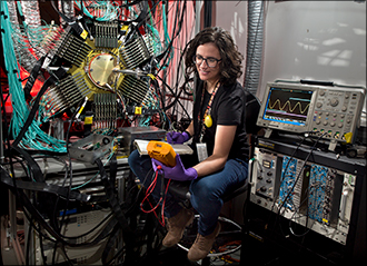Verena Geppert-Kleinrath and the fully assembled fission time projection chamber at LANSCE—the only detector of its kind.