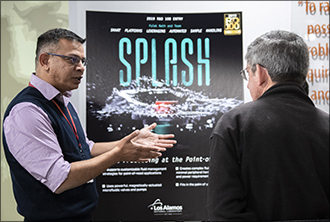 Pulak Nath, left, team lead of the R&D 100 Award winning entry SPLASH, talks to Lab Deputy Director for STE John Sarrao during the Lab's R&D 100 award ceremony.