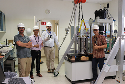 Standing in the new Rock Fracture Mechanics Lab are (l to r) Luke Frash, Wenfeng Li, Nathan Welch, and Bill Carey. The lab is located within the Geochemical Analytical Facility at TA-3.