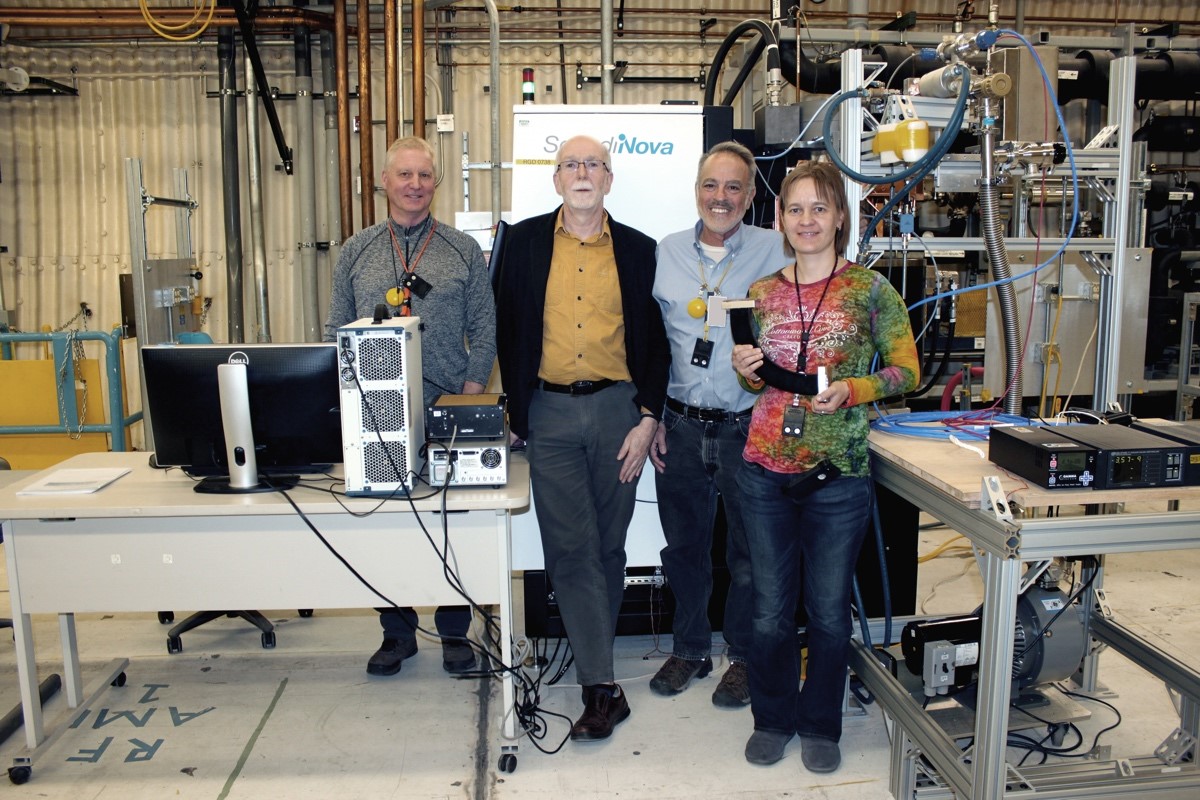 The core C-band team (from left to right): Mark Middendorf (AOT-RFE), Frank Krawczyk (AOT-AE), Mark Kirshner (AOT-RFE), and Evgenya Simakov (AOT-AE) in front of the high-power modulator and klystron.
